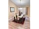 Bright dining room featuring a glass-top table and four chairs at 1159 Greenley Ave, Groveland, FL 34736