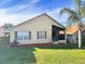 Charming single story home with brown accents and a screened porch at 1159 Greenley Ave, Groveland, FL 34736