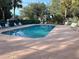 Inviting community pool with ample lounge chairs for relaxation at 1159 Greenley Ave, Groveland, FL 34736