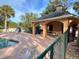 Community pool area with covered seating and picnic tables at 1159 Greenley Ave, Groveland, FL 34736