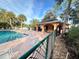 Community pool with covered pavilion and lounge chairs at 1159 Greenley Ave, Groveland, FL 34736