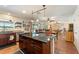 Kitchen island with granite countertop and seating at 1541 Truscott Ct, Mount Dora, FL 32757