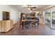 Kitchen with dark wood cabinets, granite island, and tiled floor at 1541 Truscott Ct, Mount Dora, FL 32757