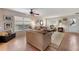 Living room with hardwood floors, neutral color palette, and ample natural light at 1541 Truscott Ct, Mount Dora, FL 32757