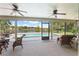 Enjoy the lake view from this screened patio with pool access at 1541 Truscott Ct, Mount Dora, FL 32757