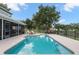 Inviting pool and patio area, perfect for outdoor relaxation and entertaining at 1541 Truscott Ct, Mount Dora, FL 32757