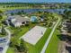 Community clubhouse with pool, volleyball court, and parking at 16039 Juniper Inlet Aly, Winter Garden, FL 34787