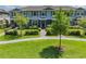 Townhome with a manicured lawn and walkway, aerial view at 16039 Juniper Inlet Aly, Winter Garden, FL 34787