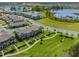 Community view showing townhome and surrounding lake at 16039 Juniper Inlet Aly, Winter Garden, FL 34787