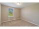 Simple bedroom with neutral walls and carpeted floor at 16039 Juniper Inlet Aly, Winter Garden, FL 34787