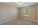 Bright bedroom with window and neutral decor at 16039 Juniper Inlet Aly, Winter Garden, FL 34787