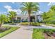 Community clubhouse entrance with lush landscaping at 16039 Juniper Inlet Aly, Winter Garden, FL 34787