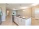 Kitchen island with granite countertop and double sink at 16039 Juniper Inlet Aly, Winter Garden, FL 34787