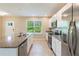 Bright kitchen featuring stainless steel appliances and granite countertops at 16039 Juniper Inlet Aly, Winter Garden, FL 34787