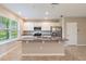 Modern kitchen featuring white cabinets, granite island, and stainless steel appliances at 16039 Juniper Inlet Aly, Winter Garden, FL 34787