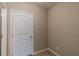 Well-lit laundry room with white door at 16039 Juniper Inlet Aly, Winter Garden, FL 34787