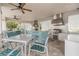 Outdoor kitchen with stainless steel appliances and seating area at 16039 Juniper Inlet Aly, Winter Garden, FL 34787