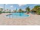 Resort-style pool with lounge chairs and a palm tree backdrop at 16039 Juniper Inlet Aly, Winter Garden, FL 34787