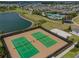 Two tennis courts and a nearby volleyball court at 16039 Juniper Inlet Aly, Winter Garden, FL 34787