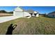 Newly constructed home with a two-car garage and well-manicured lawn at 2177 Emma Ln, Lake Wales, FL 33859