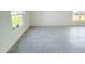 Bright living room with neutral tile flooring and lots of natural light at 2181 Emma Ln, Lake Wales, FL 33859