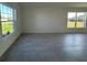 Bright living area featuring large windows offering ample natural light and views of the lawn at 2181 Emma Ln, Lake Wales, FL 33859