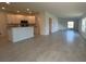 Open-concept living space with breakfast bar, tile flooring, and recessed lighting at 2181 Emma Ln, Lake Wales, FL 33859