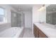 Bathroom featuring a large tub, separate glass shower, and a double sink vanity with ample counter space at 2203 Carson Loop, Lake Wales, FL 33859