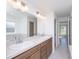 Bathroom featuring double sinks with plenty of lighting and a view to the rest of the house at 2203 Carson Loop, Lake Wales, FL 33859