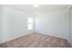 Bright bedroom with carpet flooring, a window, and a closet at 2203 Carson Loop, Lake Wales, FL 33859