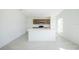 Open kitchen with island features stainless steel appliances and tile flooring at 2203 Carson Loop, Lake Wales, FL 33859