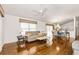 Bright and airy living room with hardwood floors and a ceiling fan at 2605 Seneca Ave, The Villages, FL 32162