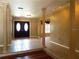 Elegant entryway with high ceilings and columns at 413 Sandy Hill Dr, Longwood, FL 32779