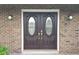 Double front doors with glass inserts at 413 Sandy Hill Dr, Longwood, FL 32779