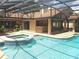 Inviting pool and spa with screened enclosure at 413 Sandy Hill Dr, Longwood, FL 32779