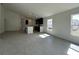 Open concept living space connecting the kitchen and living room, with tile floors throughout at 418 Central Ave, Frostproof, FL 33843