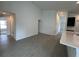 Spacious living space featuring tile flooring, neutral walls, and an open layout at 418 Central Ave, Frostproof, FL 33843