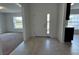 Inviting foyer with tile flooring, leading into a sunlit living space with views of the outdoors at 422 Central Ave, Frostproof, FL 33843