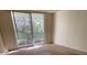 Bright bedroom with sliding glass doors to balcony at 690 Osceola Ave # 308, Winter Park, FL 32789