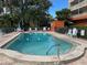 Refreshing community swimming pool with lounge chairs at 690 Osceola Ave # 308, Winter Park, FL 32789