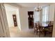 Cozy dining area with chandelier and adjacent kitchen at 690 Osceola Ave # 308, Winter Park, FL 32789