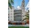 Modern condo building entrance with a clock tower at 690 Osceola Ave # 308, Winter Park, FL 32789