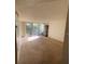 Bright living room with sliding glass doors leading to a balcony at 690 Osceola Ave # 308, Winter Park, FL 32789