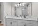 Modern bathroom with white vanity and quartz countertop at 7838 Sloewood Dr, Leesburg, FL 34748