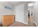 Well-lit bedroom with wood dresser and closet at 7838 Sloewood Dr, Leesburg, FL 34748