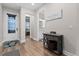 Welcoming entryway with wood-look floors and a glimpse of a bathroom at 7838 Sloewood Dr, Leesburg, FL 34748