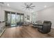 Living room with sliding doors to patio at 7838 Sloewood Dr, Leesburg, FL 34748