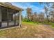 Relaxing screened porch overlooking backyard at 7838 Sloewood Dr, Leesburg, FL 34748