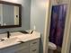 Clean bathroom with white vanity, quartz countertop, and a shower at 837 Oaks Shores Rd, Leesburg, FL 34748