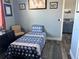 Cozy bedroom decorated with custom beddings, wall art and comfortable chair at 837 Oaks Shores Rd, Leesburg, FL 34748